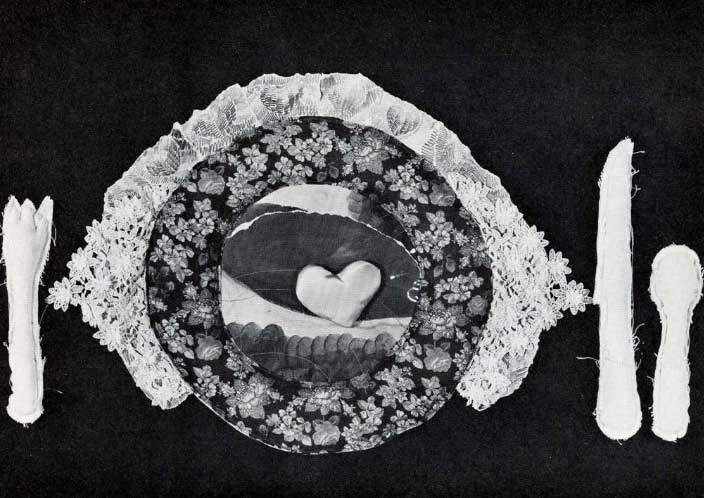 A greyscale image of a place setting (plate and fork, knife, spoon) made out of delicately collaged paper, fabric, and lace.